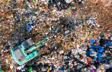 Ecosystem and healthy environment concepts and background, Garbage pile in trash dump or landfill, Aerial view garbage trucks unload garbage to a landfill, global warming. stock