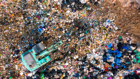 Ecosystem and healthy environment concepts and background, Garbage pile in trash dump or landfill, Aerial view garbage trucks unload garbage to a landfill, global warming. stock