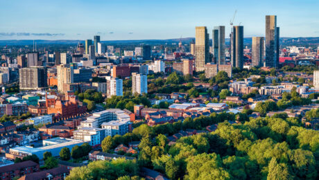 A skyline shot of the city of Manchester on a sunny day, featuring Beetham Tower and Deansgate Square South Tower.